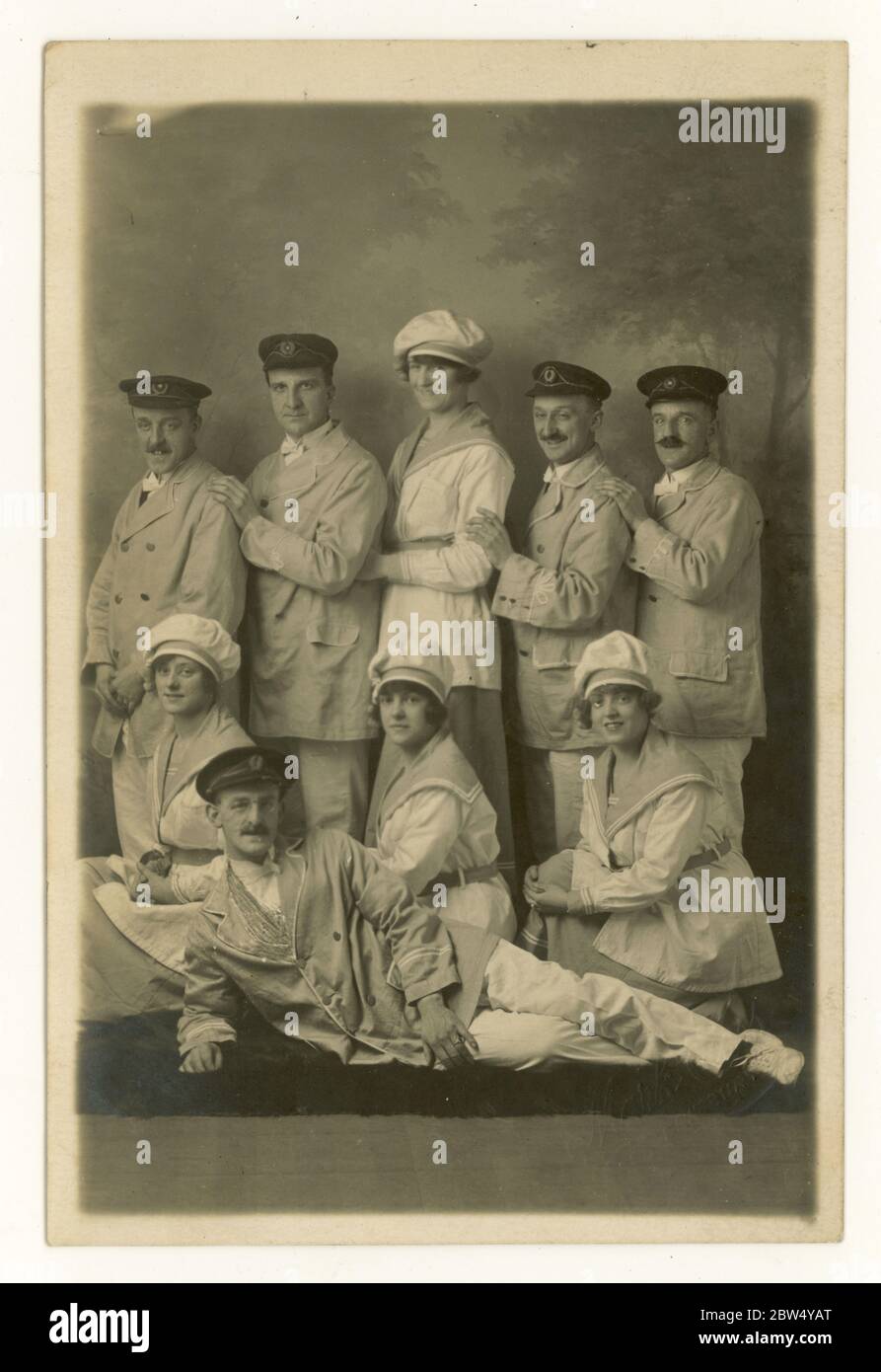 Early 1920's postcard studio portrait of show line-up featuring women dressed as sailors, wearing cook's hats, men in caps, jackets and bow-ties, possibly H.M.S. Pinafore show, Dewsbury, West Yorkshire, England, U.K. Stock Photo