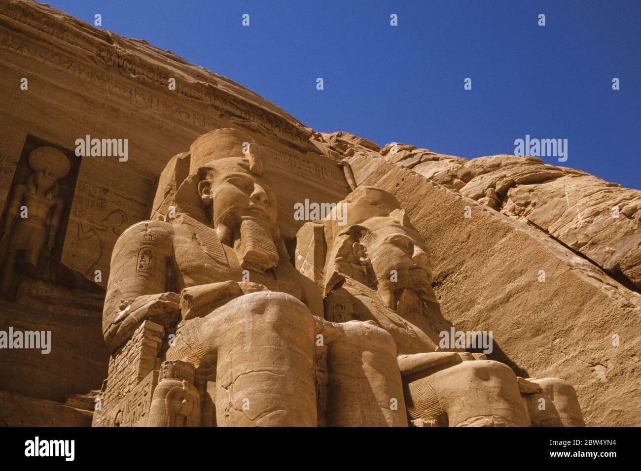 Colossal statues of pharaoh Ramses II carved into rock by the ancient