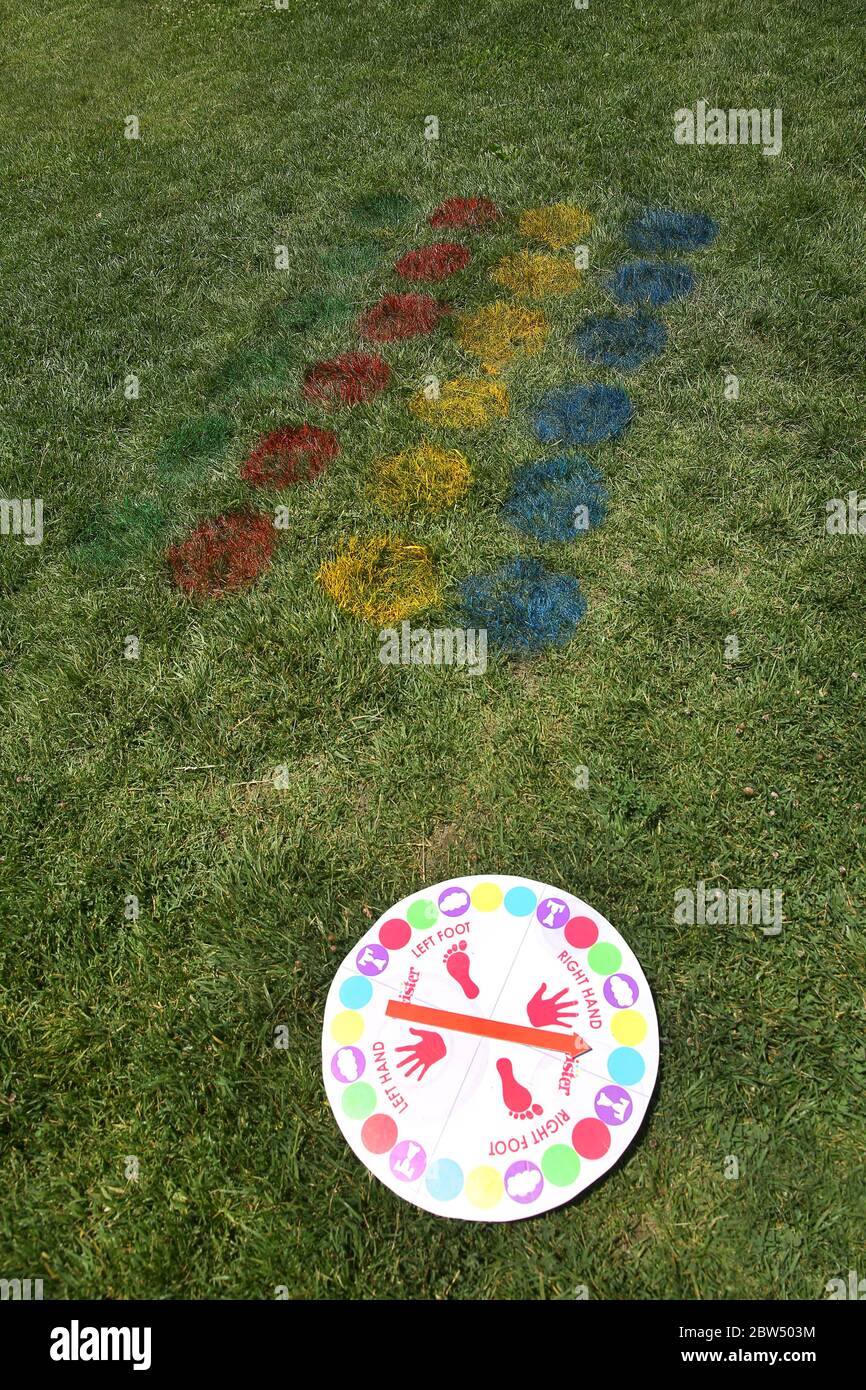 Children play . twister body games . twister body games . Funny Twist The Body Game Classic Game With 2 More Moves Family Party Games . Kids festival Stock Photo