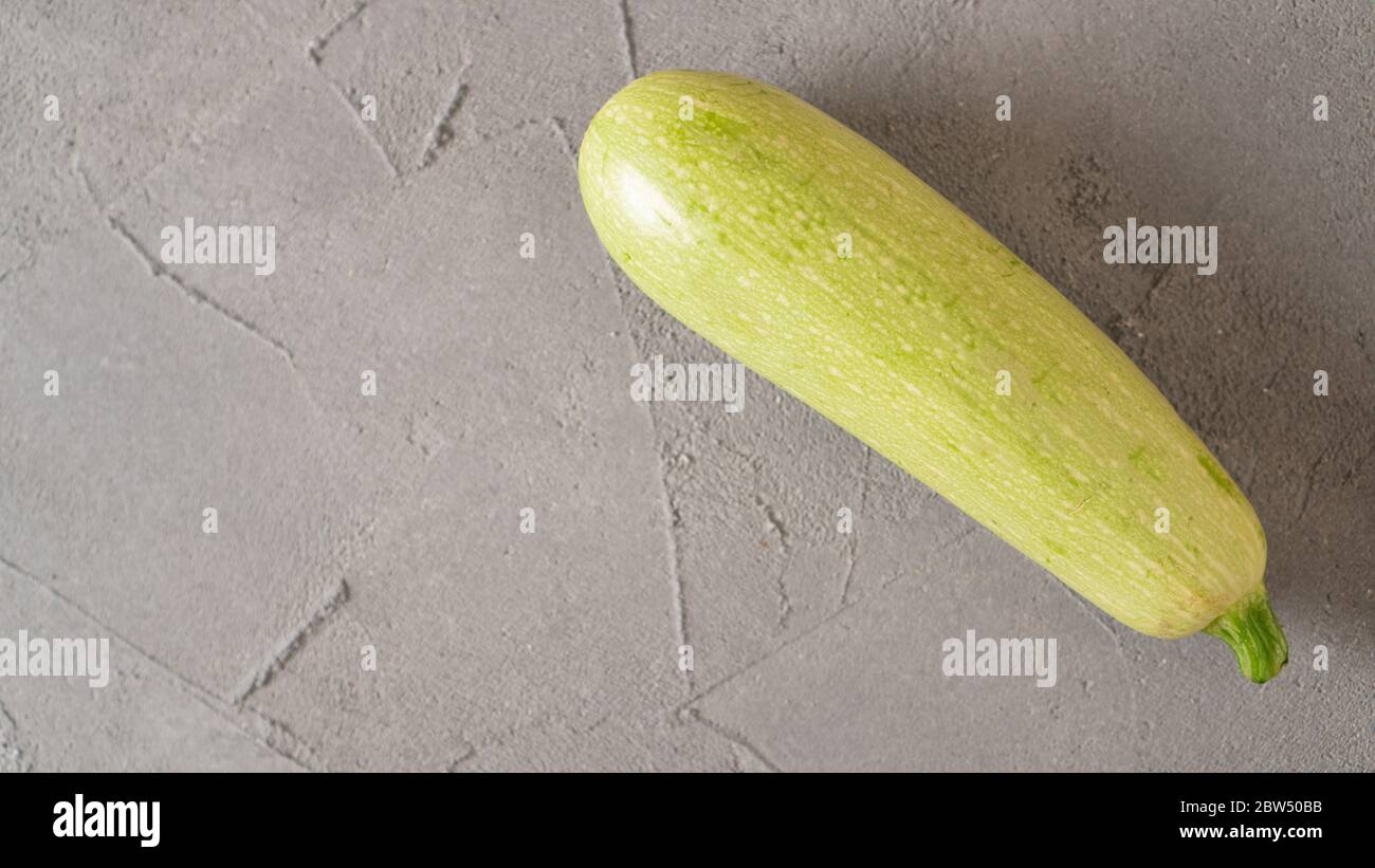 Fresh Ripe Single Gray Zucchini On Concrete Background Scattered Cucumbers One Grey Zucchini On The Table Close Up Stock Photo Alamy