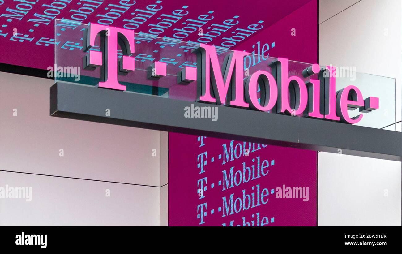 April 15, 2019, Santa Monica, California, U.S: T-Mobile US, Inc., commonly shortened to T-Mobile, is an American wireless network operator; its largest shareholder is the German telecommunications company Deutsche Telekom (DT) with a 43% share, with Japanese conglomerate holding company SoftBank Group partially owning the company as well at a 24% share. The remaining 33% share of the company is owned by the public through common stock. Its headquarters are located in Bellevue, Washington, in the Seattle metropolitan area. T-Mobile is the third-largest wireless carrier in the United States, wit Stock Photo