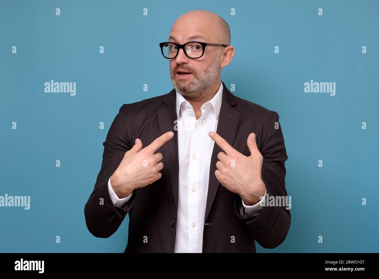 man looking disappointedly at camera pointing at himself with hands Stock Photo