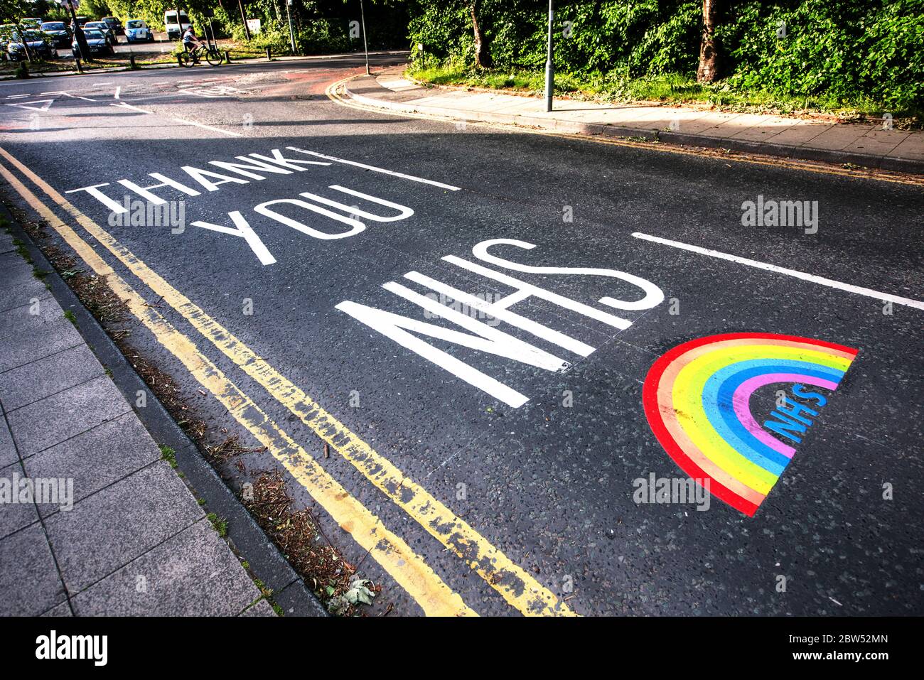 Newly painted road markings Thank you NHS and a rainbow have been painted outside a medical centre in Manchester to thank all the front line NHS staff. Stock Photo