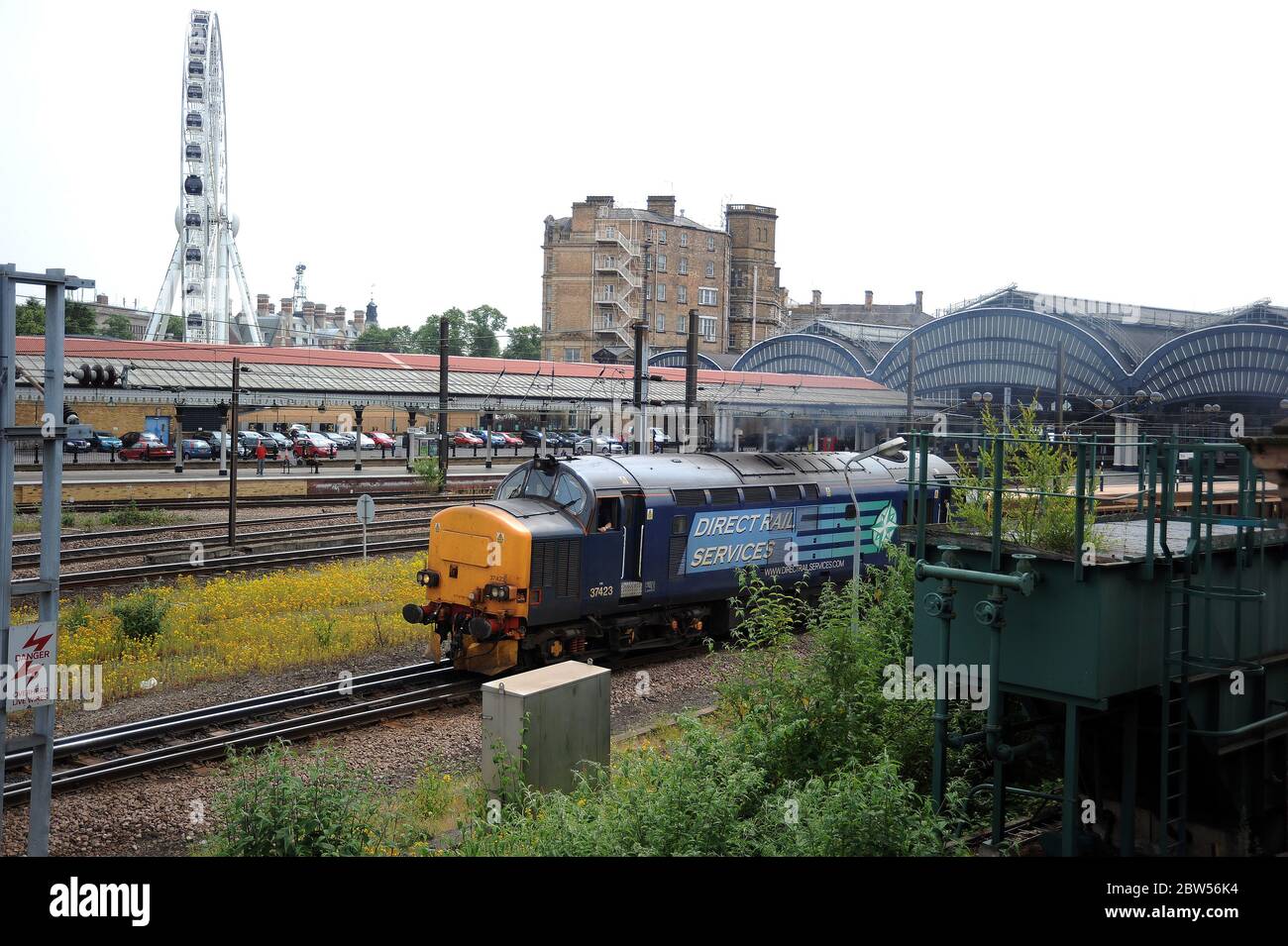 37423 'Spirit of the Lakes' passes through York Station with a ballast train. Seen from the viewing gallery at the N.R.M. Stock Photo
