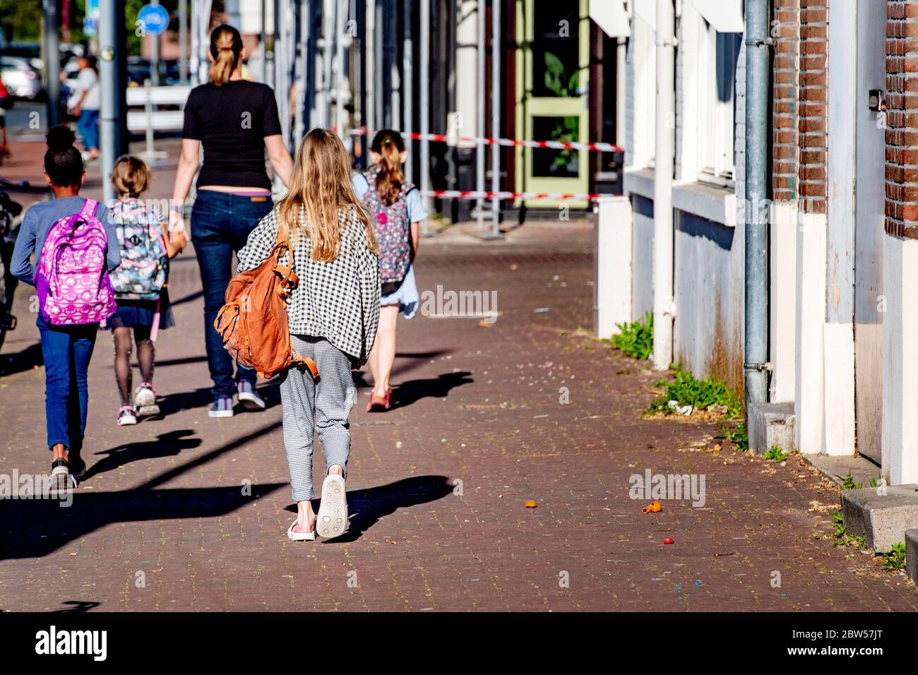 Children walk to school during the coronavirus crisis.School children ...