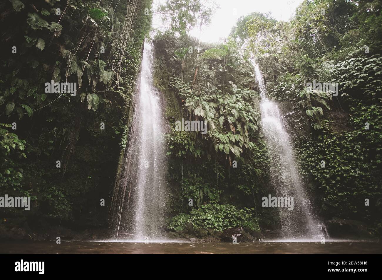 Waterfall in the jungle of Lombok Stock Photo
