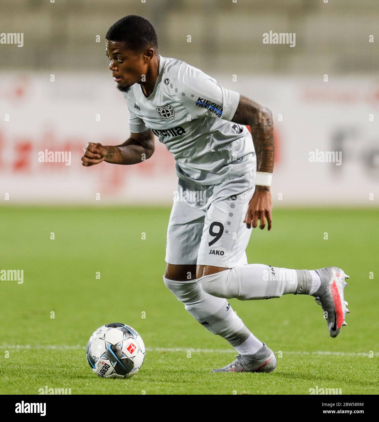 Freiburg Im Breisgau, Germany. 29th May, 2020. Football: Bundesliga, SC Freiburg - Bayer Leverkusen, 29th matchday at the Black Forest Stadium. Leverkusen's Leon Bailey is on the ball. Credit: Ronald Wittek/epa/Pool/dpa - IMPORTANT NOTE: In accordance with the regulations of the DFL Deutsche Fußball Liga and the DFB Deutscher Fußball-Bund, it is prohibited to exploit or have exploited in the stadium and/or from the game taken photographs in the form of sequence images and/or video-like photo series./dpa/Alamy Live News Stock Photo