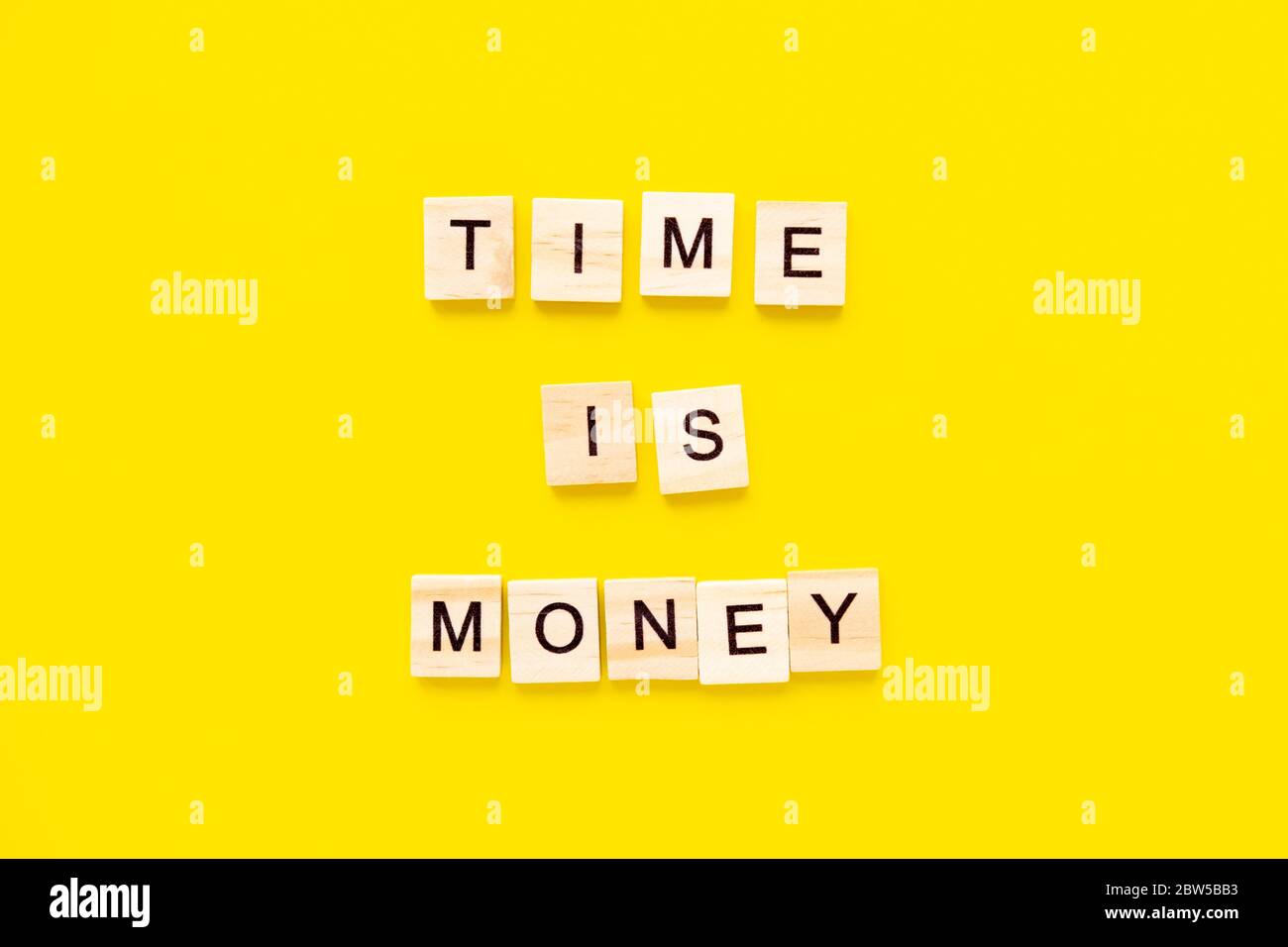 Words Time is money on yellow background. business concept Stock Photo