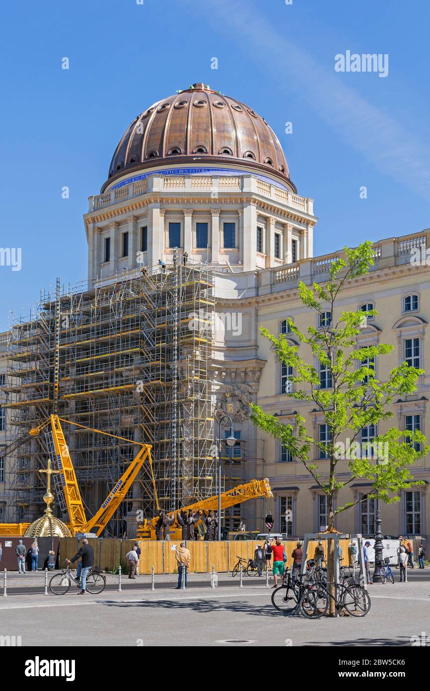 Berlin, Germany -  May 29, 2020: Reconstruction of the  Berlin City Palace (German: Berliner Stadtschloss). Preparing to put on the golden cupola on t Stock Photo