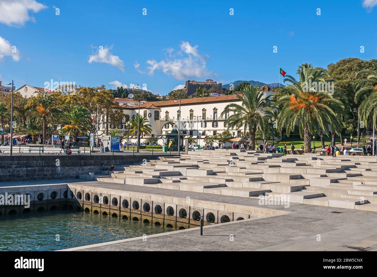 Funchal, Portugal -  November 10, 2019: Seaside promenade Avenida do Mar with the fortress Sao Lourenco Palace and Pico Fort - Saint John the Baptist Stock Photo