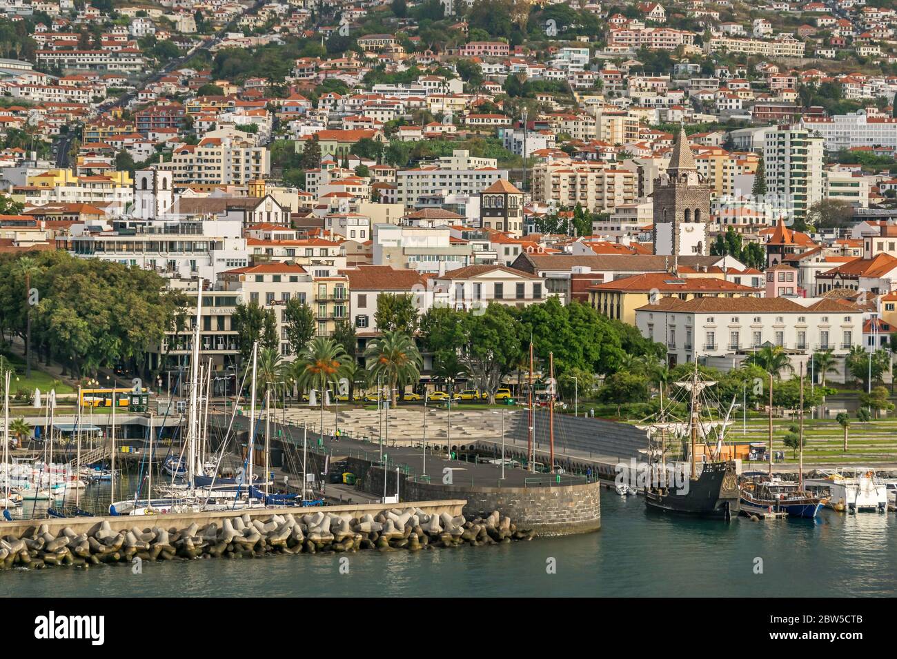 Cityscape of Funchal with its historic center and Cathedral of Funchal (Sé Cathedral), functional replica of Columbus' flagship Santa María, seaside p Stock Photo