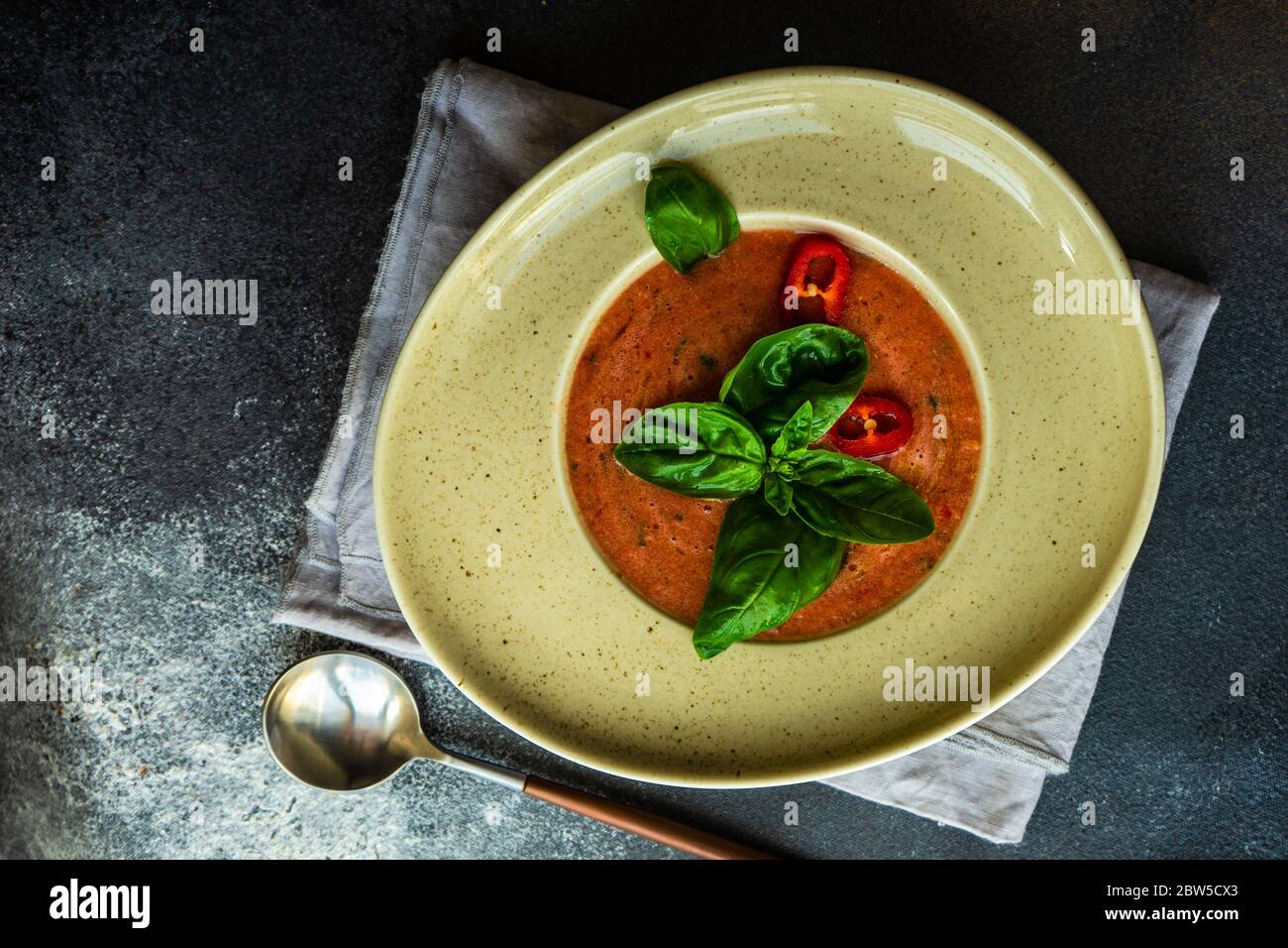 Traditional spanish tomato soup Gazpacho derved in ceranic bowl with