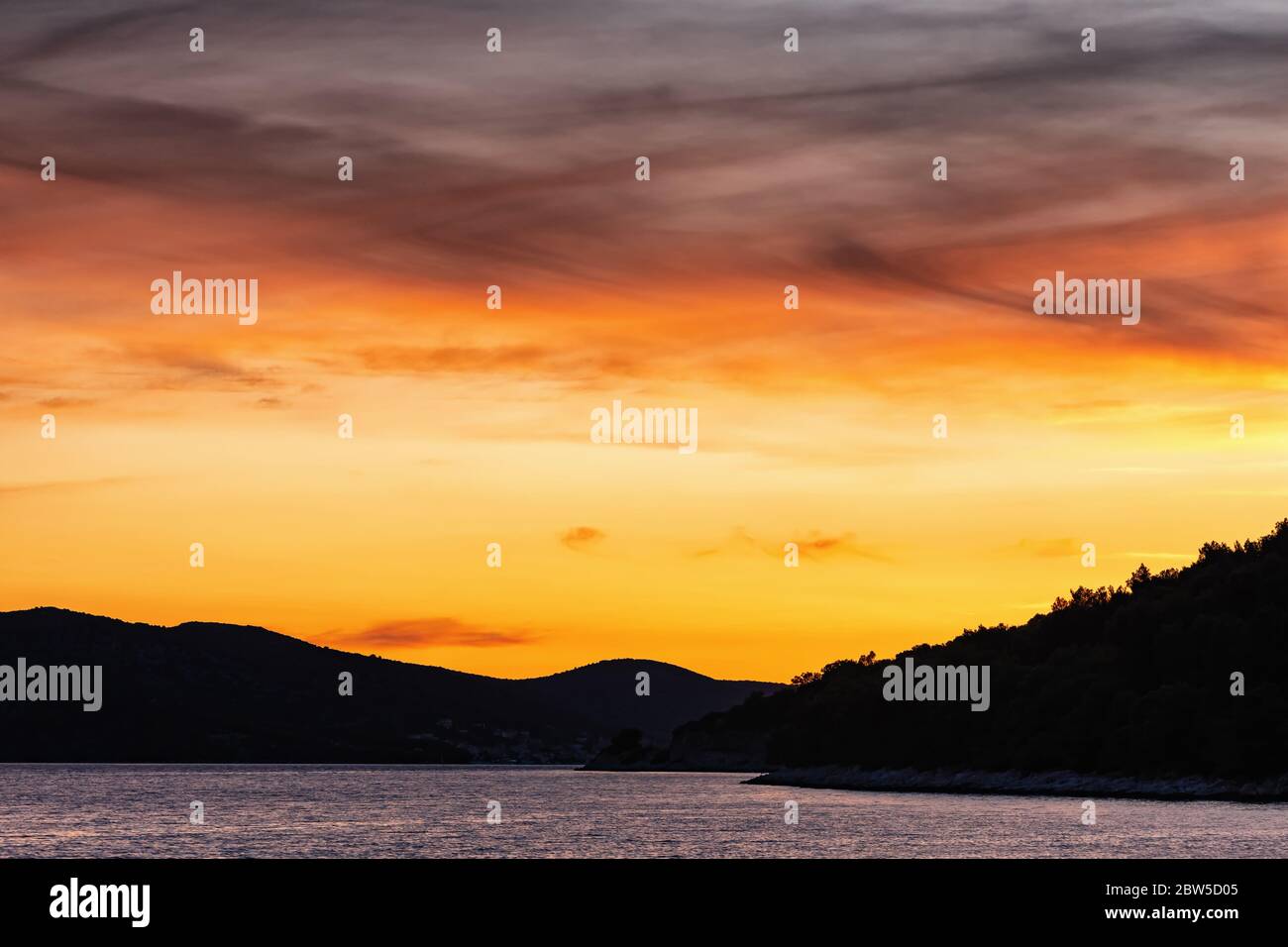 Beautiful dramatic sunset sky over the sea Stock Photo