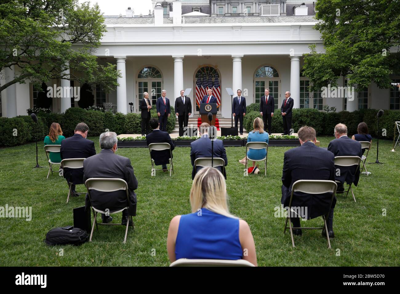 United States President Donald J. Trump with members of his administration delivers remarks on China in the Rose Garden at the White House in Washington, DC on May 29, 2020. Pictured from left to right: Peter Navarro, Director of Trade and Industrial Policy and Director of the White House National Trade Council; US National Security Advisor Robert C. O'Brien; US Secretary of State Mike Pompeo; the president; US Secretary of the Treasury Steven T. Mnuchin; Ambassador Robert Lighthizer, US Trade Representative; and Director of the National Economic Council Larry Kudlow.Credit: Yuri Gripas/Poo Stock Photo