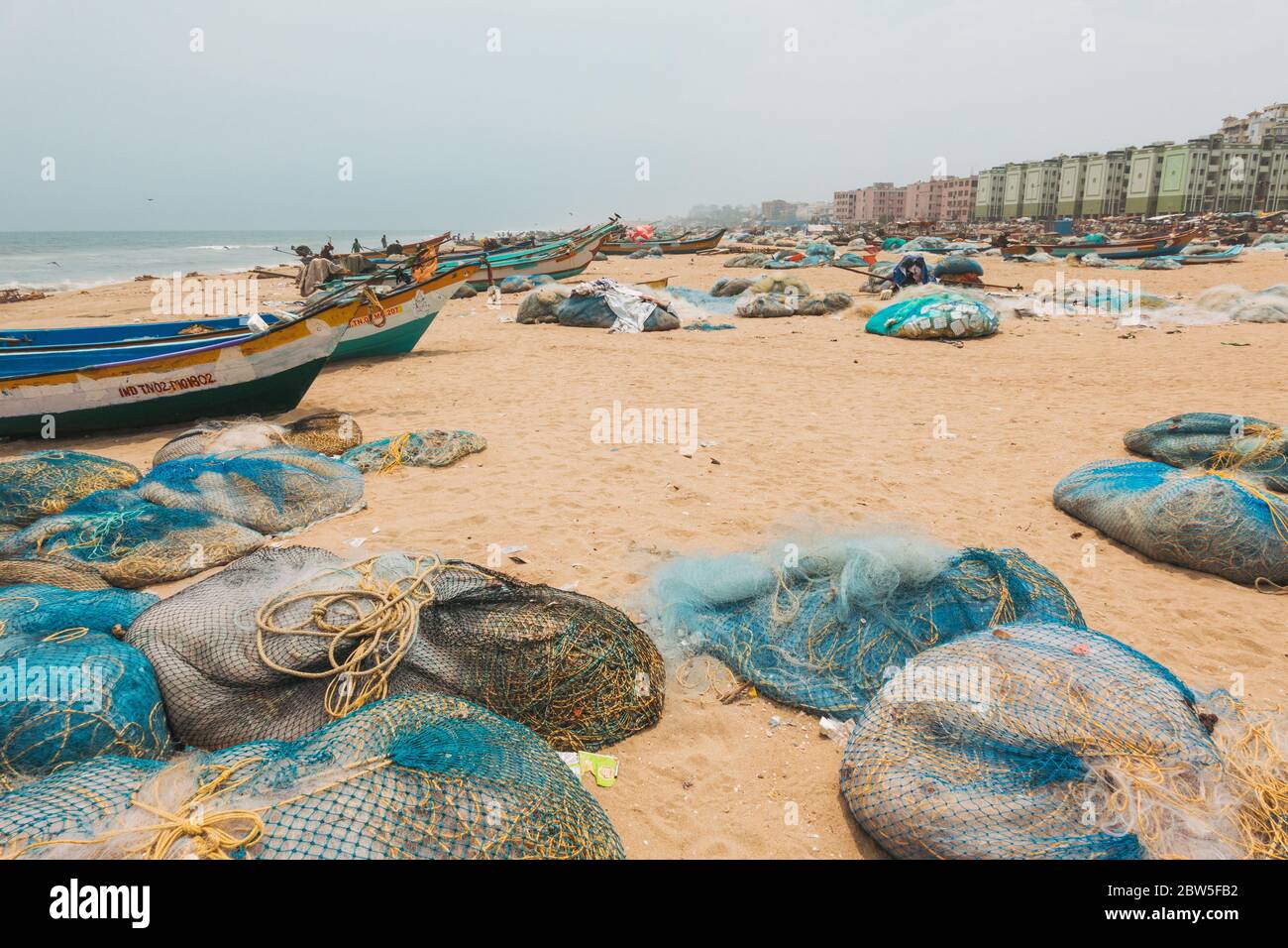 Hundreds of fishing boats and nets parked on the shore of Marina Beach