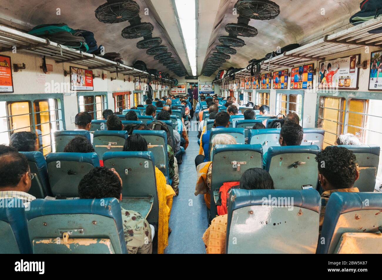 The cabin full of Indian commuters aboard a train in Kerala, India