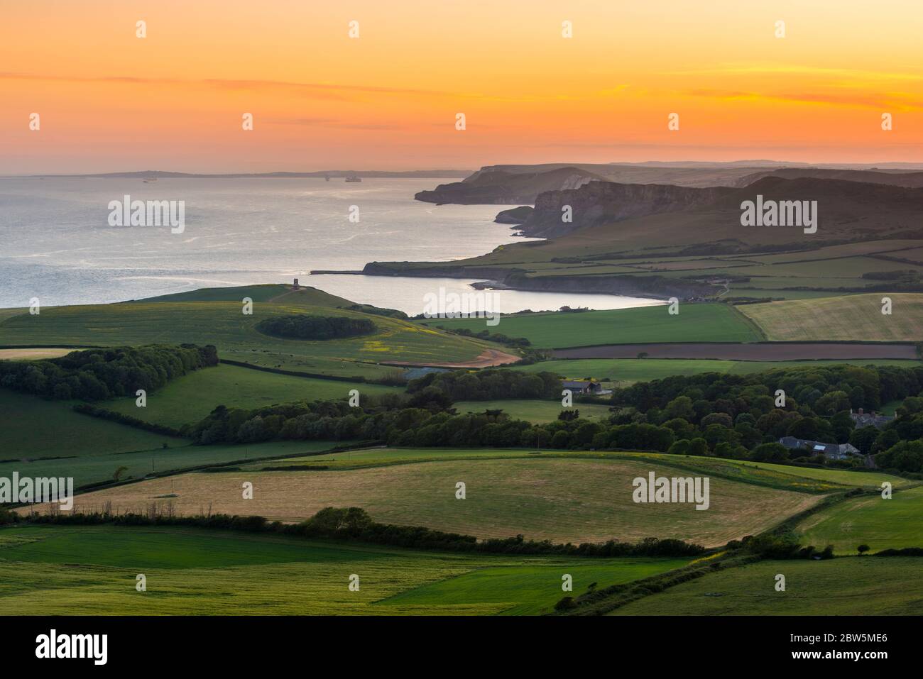 Swyre Head, Kingston, Dorset, UK.  29th May 2020.  UK Weather.  The sunset viewed from Swyre Head looking west across Kimmeridge Bay and Warbarrow Bay in Dorset at the end of a warm sunny day with clear skies.  Picture Credit: Graham Hunt/Alamy Live News Stock Photo