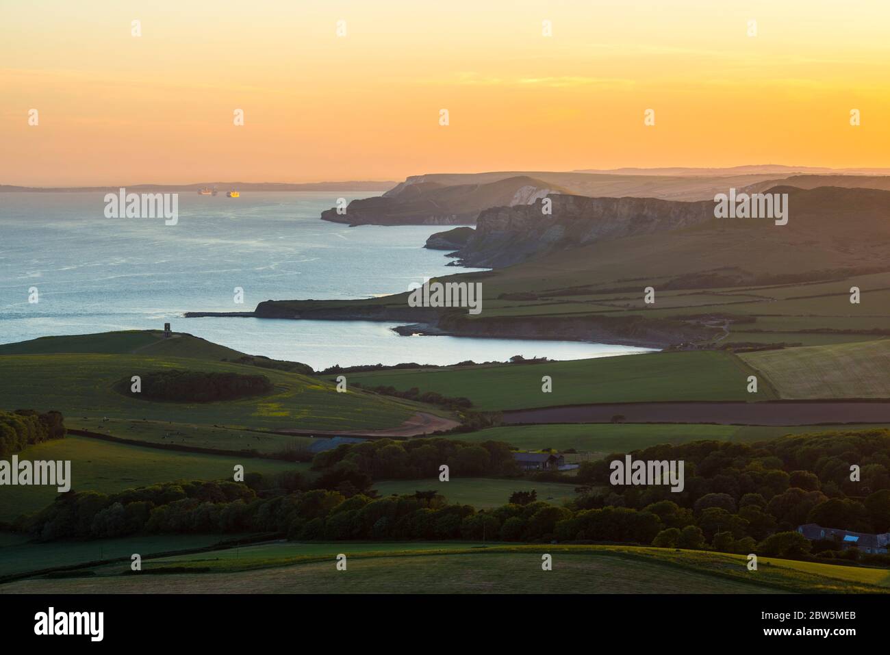 Swyre Head, Kingston, Dorset, UK.  29th May 2020.  UK Weather.  The sunset viewed from Swyre Head looking west across Kimmeridge Bay and Warbarrow Bay in Dorset at the end of a warm sunny day with clear skies.  Picture Credit: Graham Hunt/Alamy Live News Stock Photo