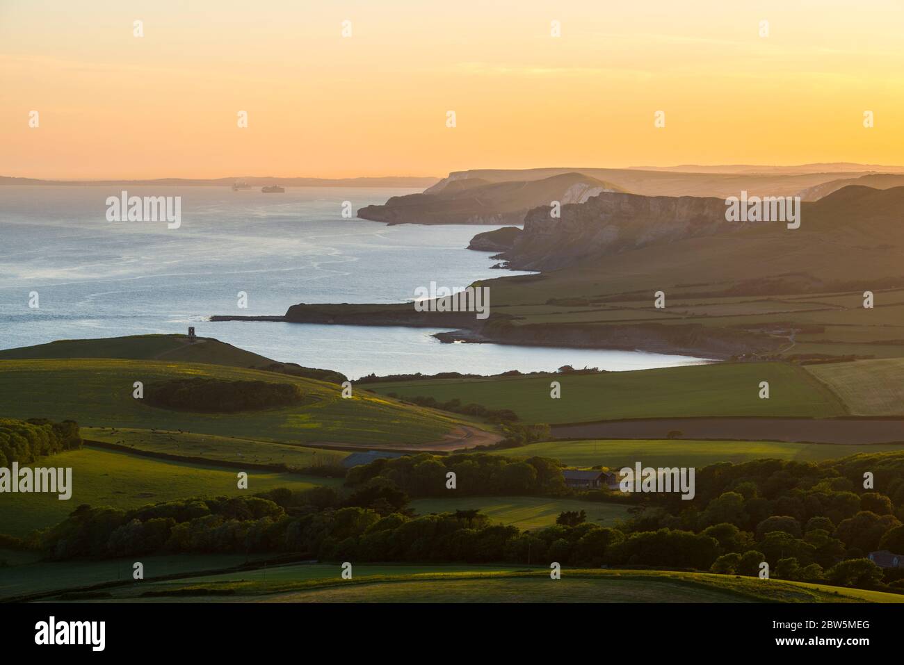 Swyre Head, Kingston, Dorset, UK.  29th May 2020.  UK Weather.  The sunset viewed from Swyre Head looking west across Kimmeridge Bay and Warbarrow Bay in Dorset at the end of a warm sunny day with clear skies.  Picture Credit: Graham Hunt/Alamy Live News Stock Photo