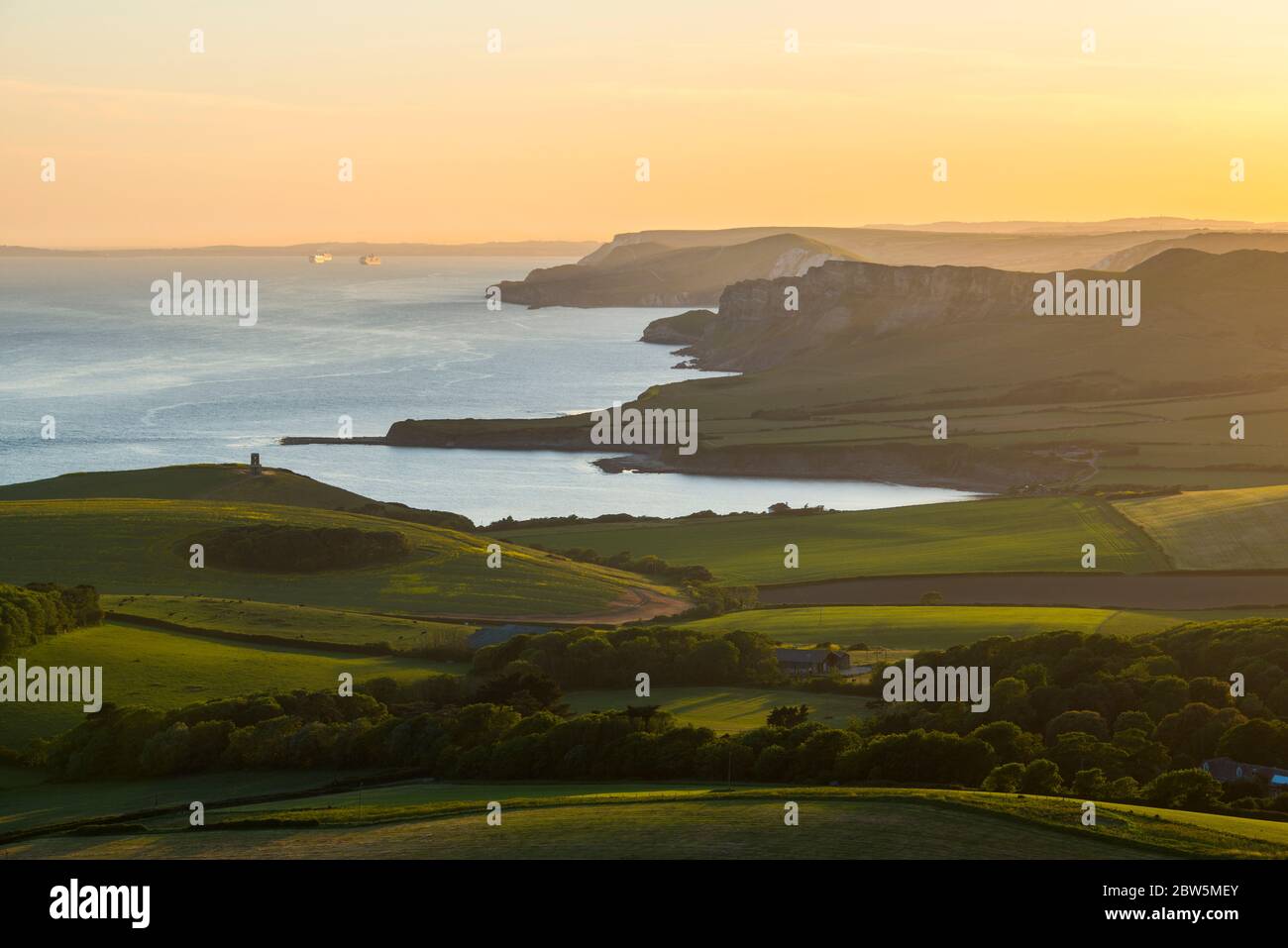 Swyre Head, Kingston, Dorset, UK.  29th May 2020.  UK Weather.  The sunset viewed from Swyre Head looking west across Kimmeridge Bay and Warbarrow Bay in Dorset at the end of a warm sunny day with clear skies.  Picture Credit: Graham Hunt/Alamy Live News Stock Photo