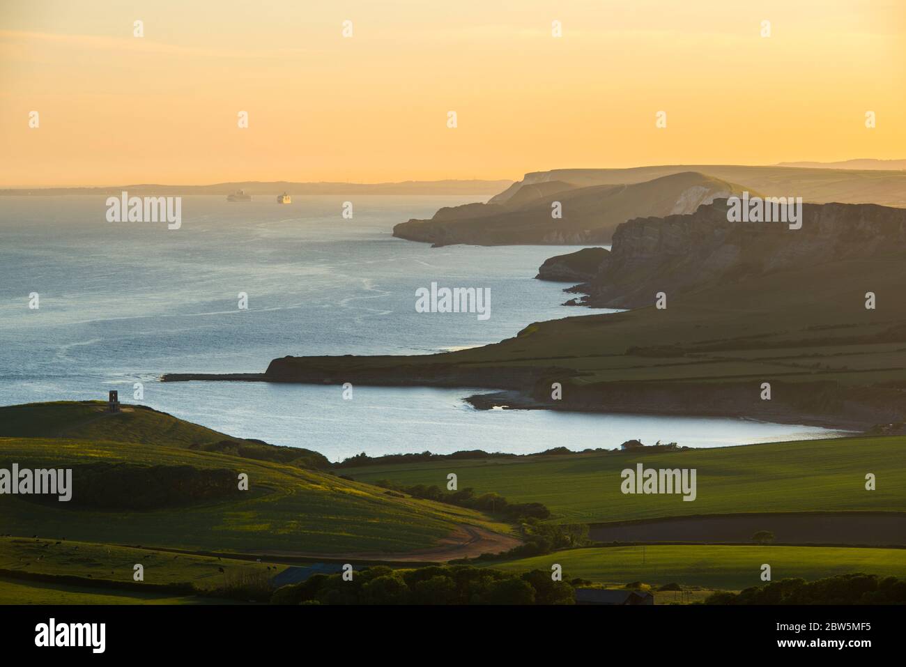 Swyre Head, Kingston, Dorset, UK.  29th May 2020.  UK Weather.  The sunset viewed from Swyre Head looking west across Kimmeridge Bay and Warbarrow Bay in Dorset at the end of a warm sunny day with clear skies.  Picture Credit: Graham Hunt/Alamy Live News Stock Photo