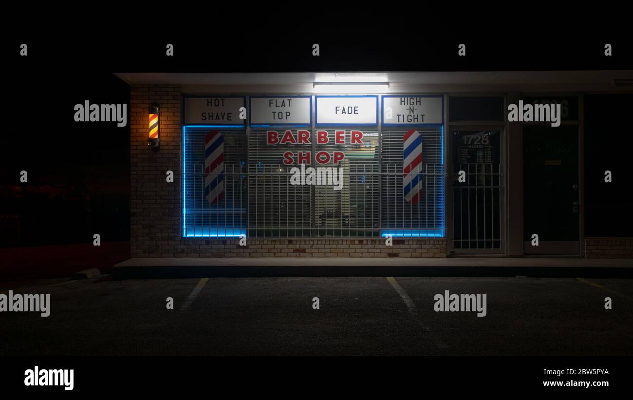 Barber shop storefront at night Stock Photo