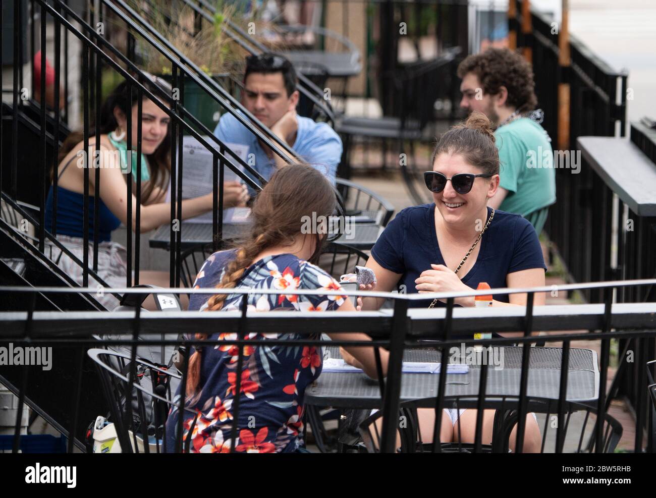 Washington, Untied States. 29th May, 2020. Diners socialize at a restaurant in the Adams Morgan neighborhood of Washington, DC on May 29, 2020. The DC Metro region is beginning to reopen starting with outdoor dinning establishments after the nearly three month lockdown due to the COVID-19 pandemic. Photo by Kevin Dietsch/UPI Credit: UPI/Alamy Live News Stock Photo