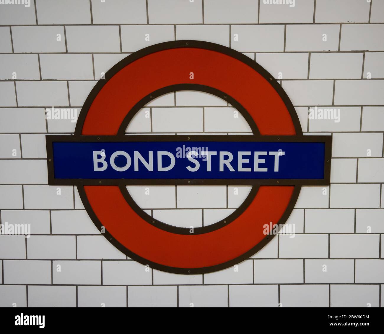 Bond Street Londonn Underground sign roundel on the Central Line with white tiles behind. London Stock Photo