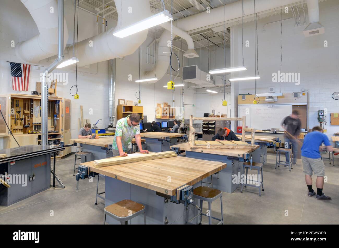 High School Wood shop with students creating projects. Stock Photo