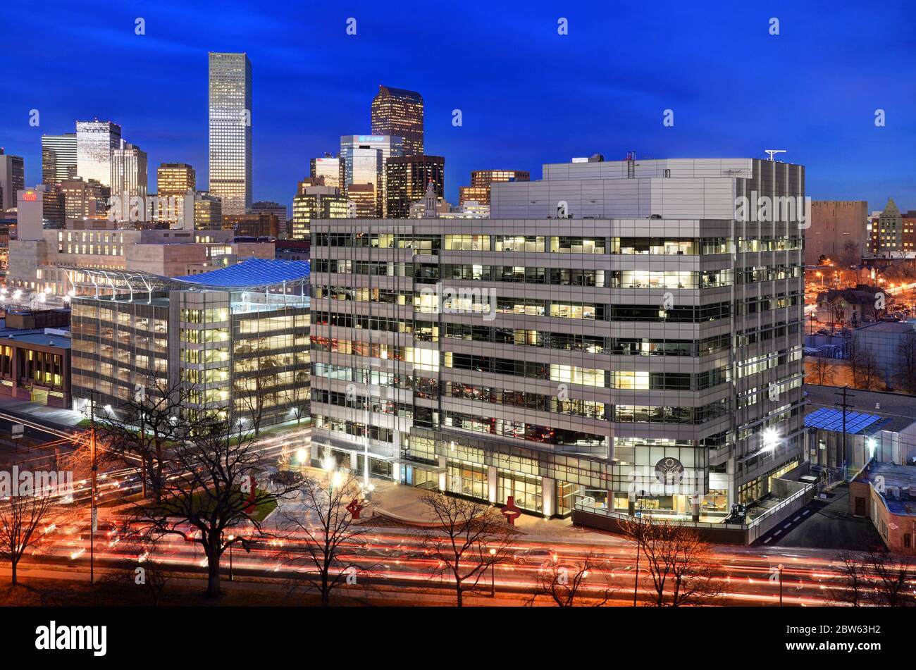 Denver, Colorado Skyline at night from Speer Blvd. featuring the GSA building and parking lot. Stock Photo