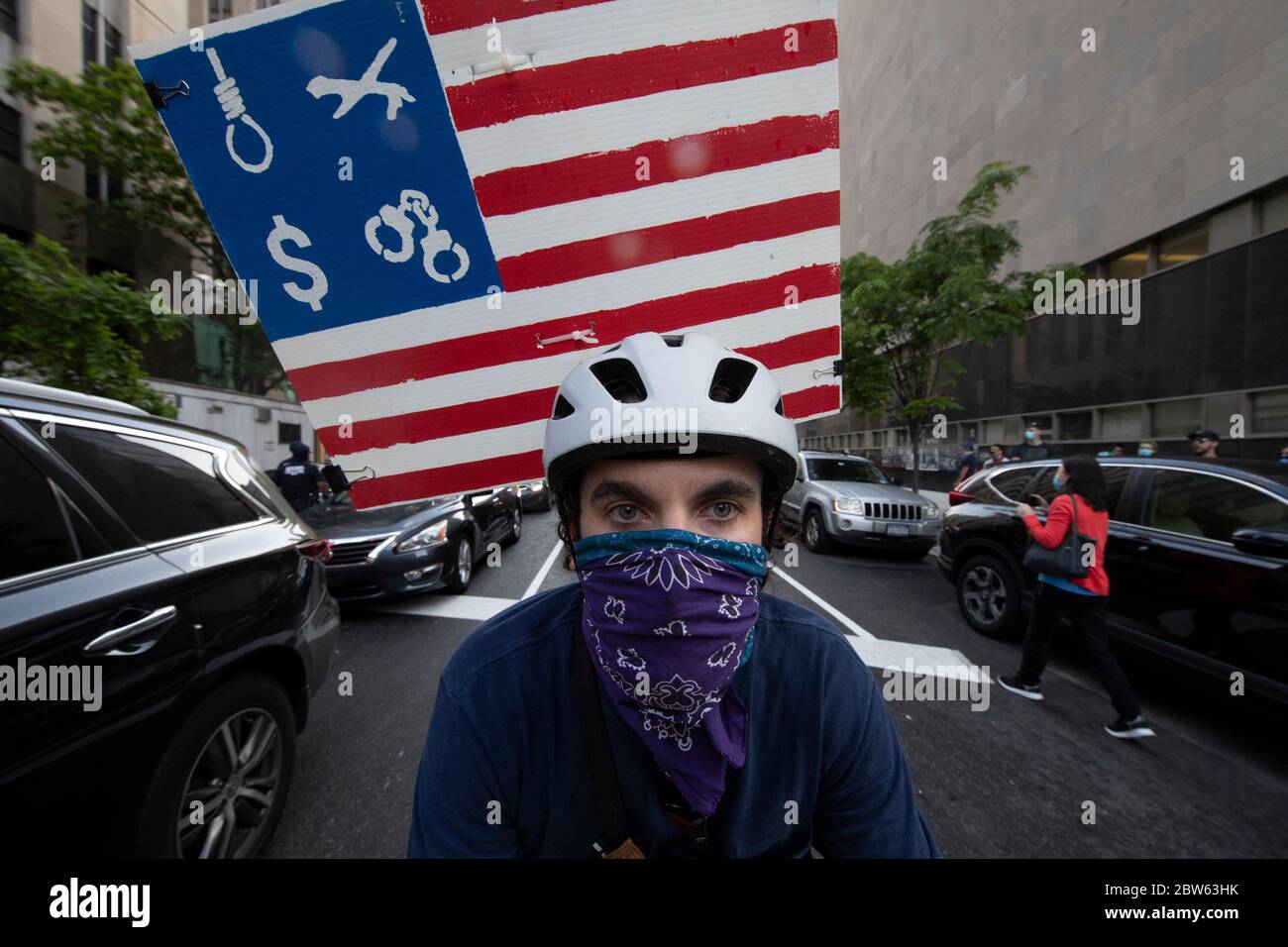 New York, New York, USA. 29th May, 2020. JAMES MCFADDEN of Brooklyn, New York, participates in the protest killing of GEORGE FLOYD during a rally near Manhattan Criminal Court in New York, New York. MCFADDEN's post represents 'what the United States Stands for, being about money inequality, racism.'' .For the second day protesters took to the street rallying against recent police misconduct, racial killings and altercations against African Americans'' including the latest death of George Floyd by Minneapolis, Minnesota Police officer Derek Chauvin. Several arrests were made at the protes Stock Photo