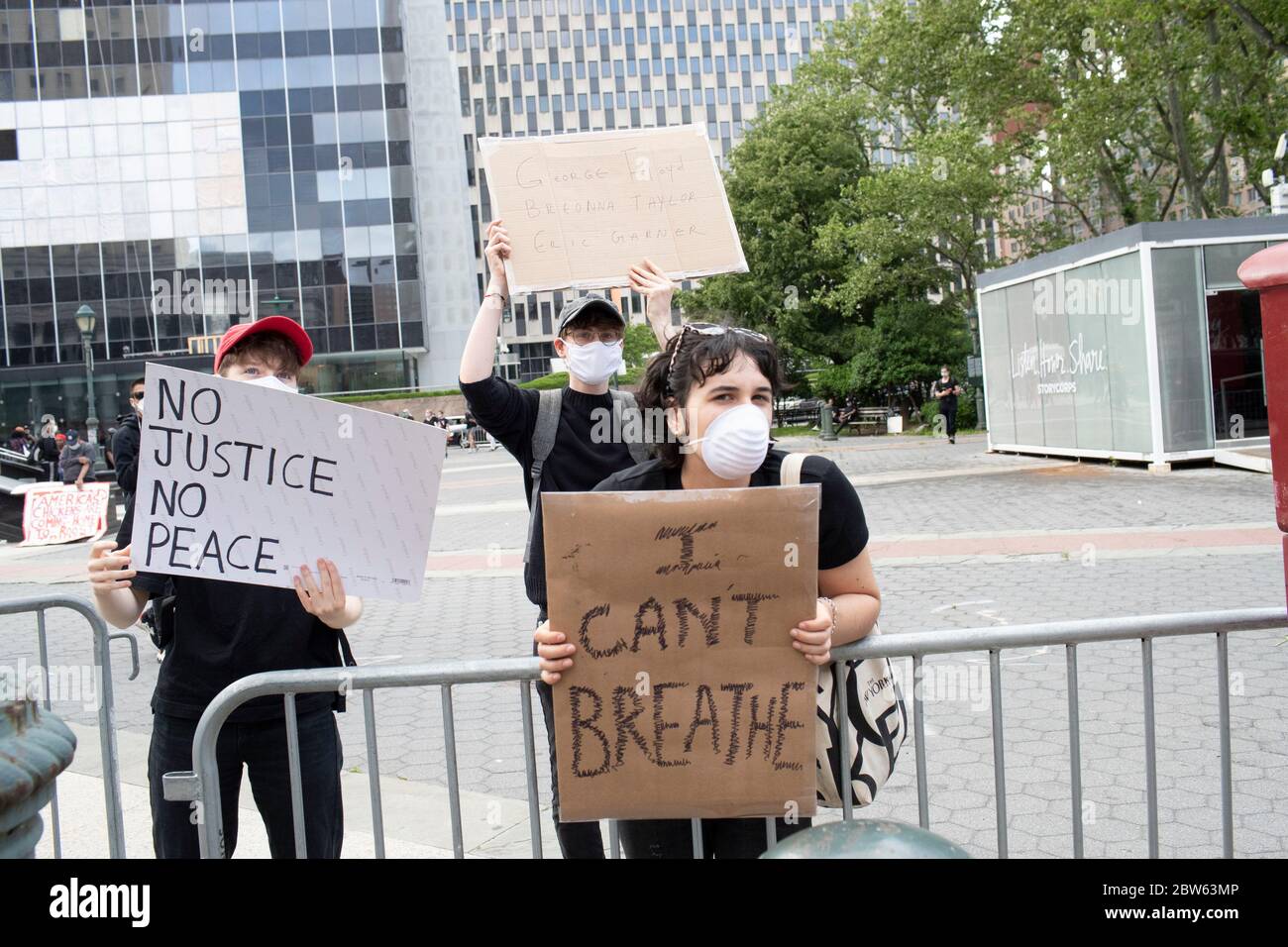 New York, New York, USA. 29th May, 2020. A demonstrator posts' a signs during a demonstration at Foley Square in New York, New York. For the second day protesters took to the street rallying against recent police misconduct, racial killings and altercations against African Americans Credit: Brian Branch Price/ZUMA Wire/Alamy Live News Stock Photo