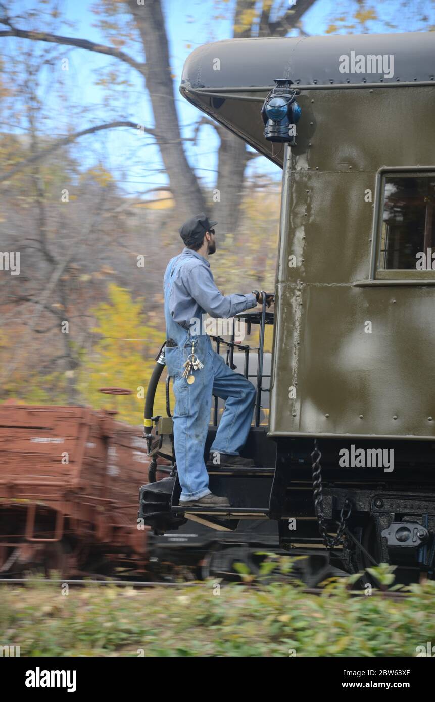 Railroad Engineer on the caboose of a vintage Train Stock Photo Alamy