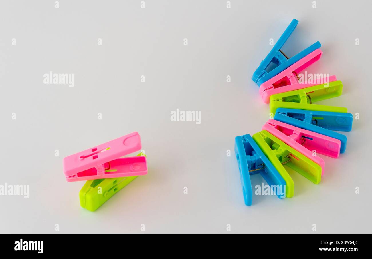 The multi-colored clothespins on a white background. Stock Photo