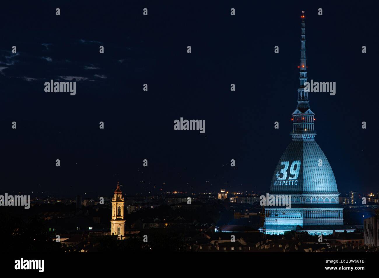 Turin, Italy. 29th May, 2020. A general view of the Mole Antonelliana illuminated in honour of the victims of the Heysel Stadium disaster in Turin. On May 29, 1985, 39 died and 600 were injured at Heysel Stadium prior to the European Cup Final between Juventus and Liverpool, when escaping Juventus fans were crushed against a wall that eventually collapsed, after trouble that broke out between supporters lead to a charge by Liverpool fans. (Photo by Cris Faga/Pacific Press) Credit: Pacific Press Agency/Alamy Live News Stock Photo