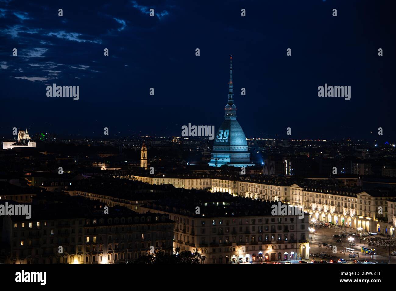 Turin, Italy. 29th May, 2020. A general view of the Mole Antonelliana illuminated in honour of the victims of the Heysel Stadium disaster in Turin. On May 29, 1985, 39 died and 600 were injured at Heysel Stadium prior to the European Cup Final between Juventus and Liverpool, when escaping Juventus fans were crushed against a wall that eventually collapsed, after trouble that broke out between supporters lead to a charge by Liverpool fans. (Photo by Cris Faga/Pacific Press) Credit: Pacific Press Agency/Alamy Live News Stock Photo