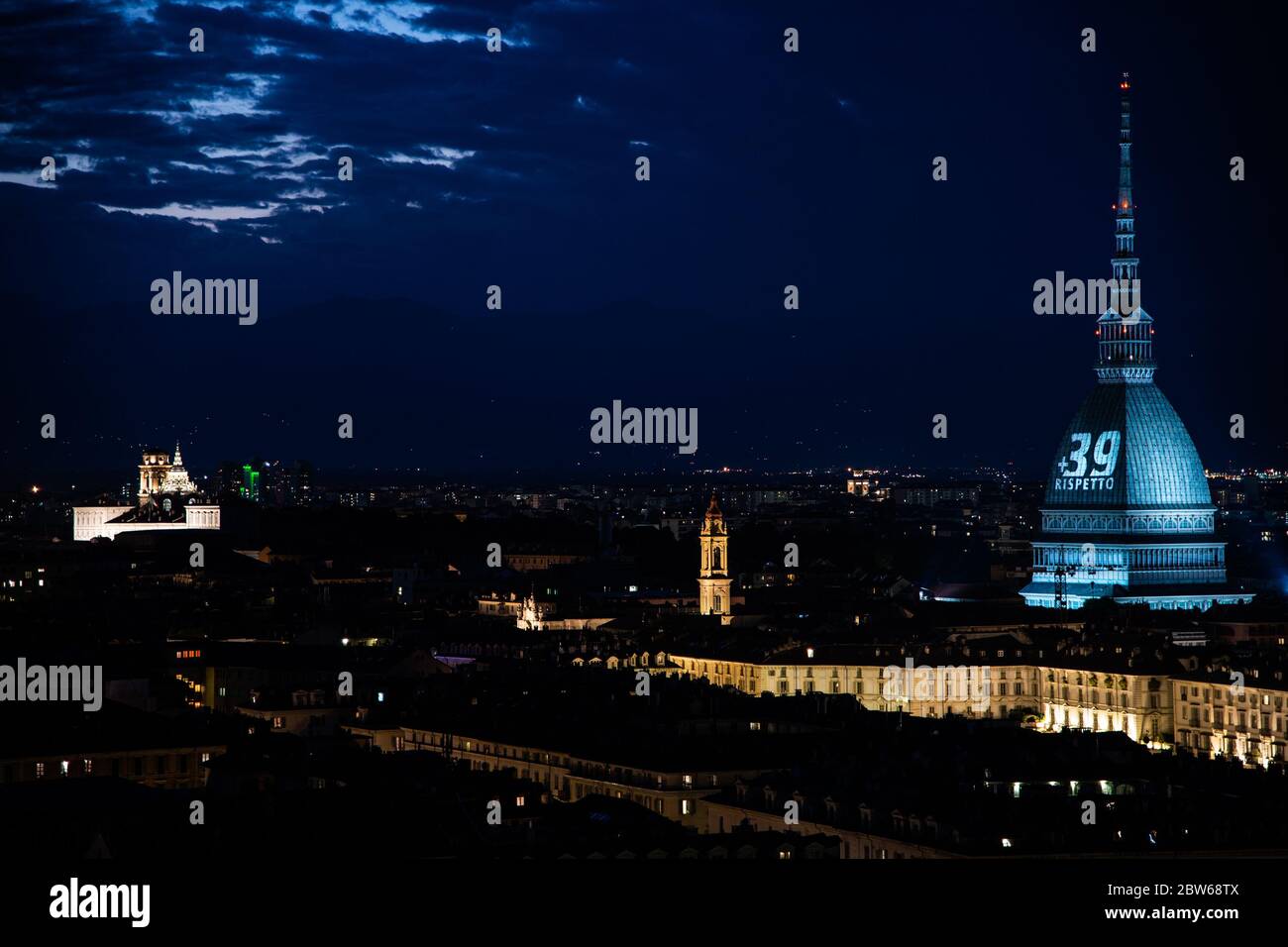 Turin, Italy. 29th May, 2020. A general view of the Mole Antonelliana illuminated in honour of the victims of the Heysel Stadium disaster in Turin. On May 29, 1985, 39 died and 600 were injured at Heysel Stadium prior to the European Cup Final between Juventus and Liverpool, when escaping Juventus fans were crushed against a wall that eventually collapsed, after trouble that broke out between supporters lead to a charge by Liverpool fans. (Photo by Cris Faga/Pacific Press) Credit: Pacific Press Agency/Alamy Live News Stock Photo