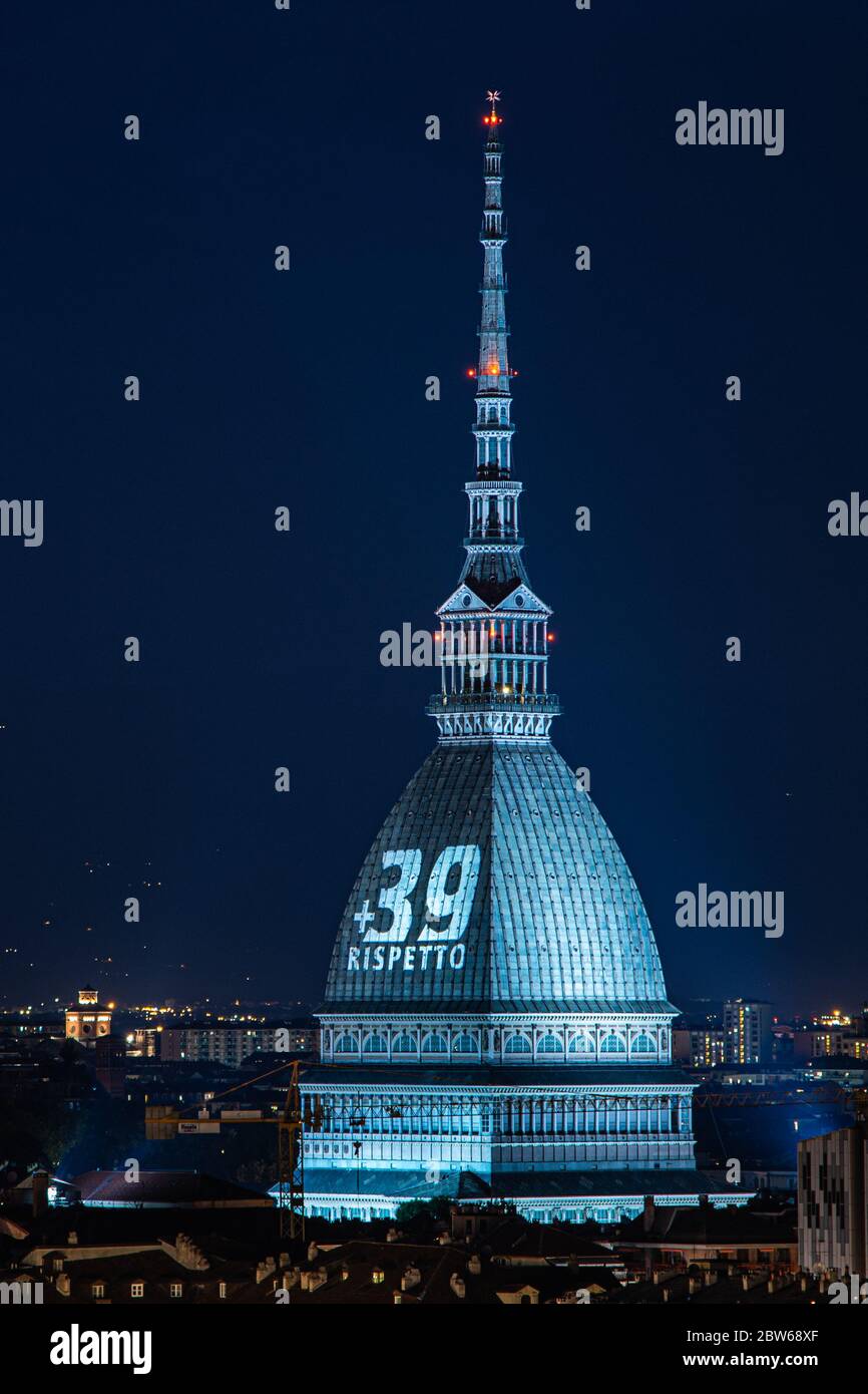 Turin, Italy. 29th May, 2020. A general view of the Mole Antonelliana illuminated in honour of the victims of the Heysel Stadium disaster in Turin. On May 29, 1985, 39 died and 600 were injured at Heysel Stadium prior to the European Cup Final between Juventus and Liverpool, when escaping Juventus fans were crushed against a wall that eventually collapsed, after trouble that broke out between supporters lead to a charge by Liverpool fans. (Photo by Cris Faga/Pacific Press) Credit: Pacific Press Agency/Alamy Live News Stock Photo