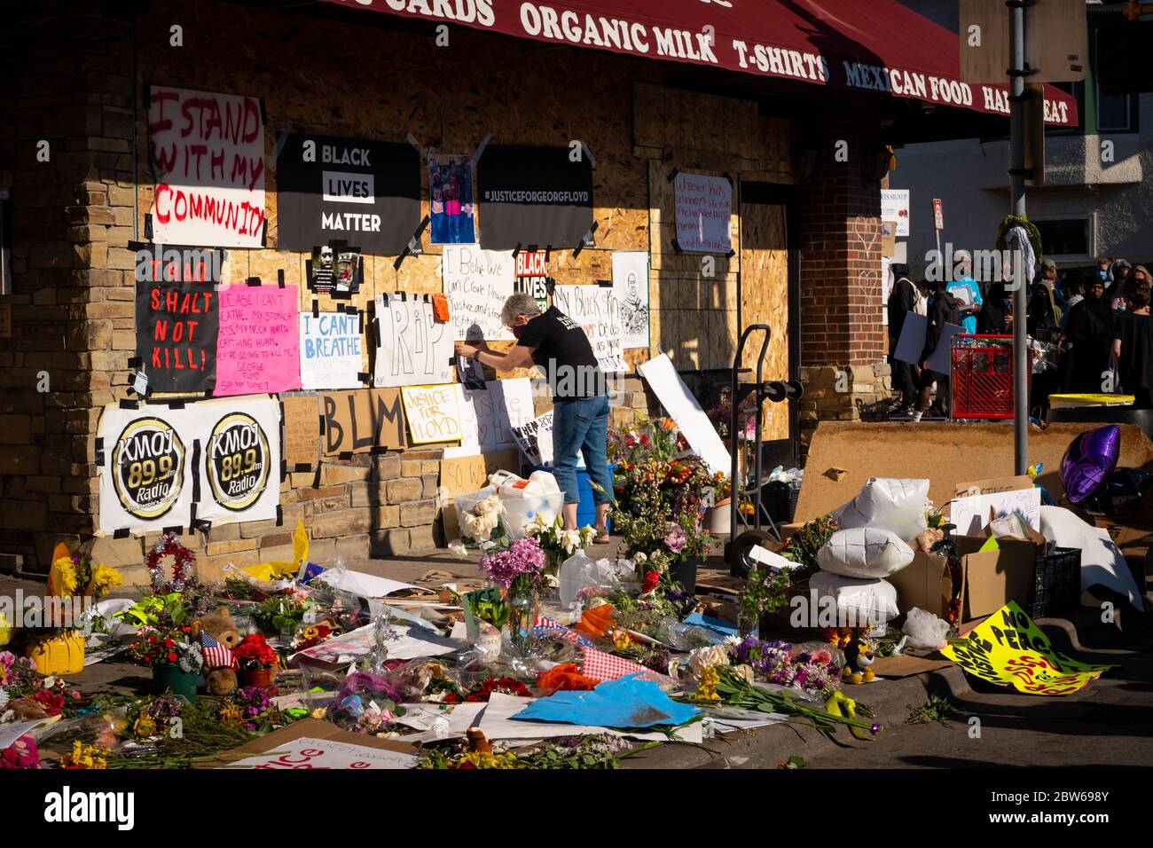 cup foods george floyd memorial honoring black lives matter in minneapolis riots white woman black lives matter posting sign Stock Photo