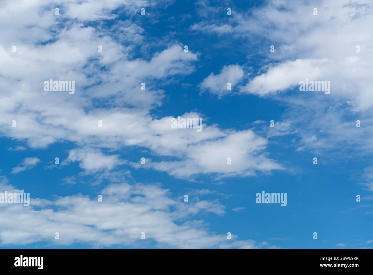 Beautiful blue sky with white cloud. Fluffy clouds moving in the wind on the blue sky. Stock Photo