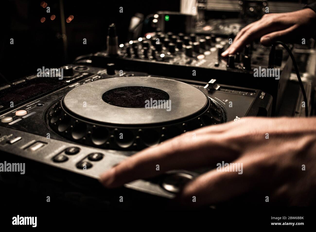 Dj turntables mixing party music in disco Stock Photo