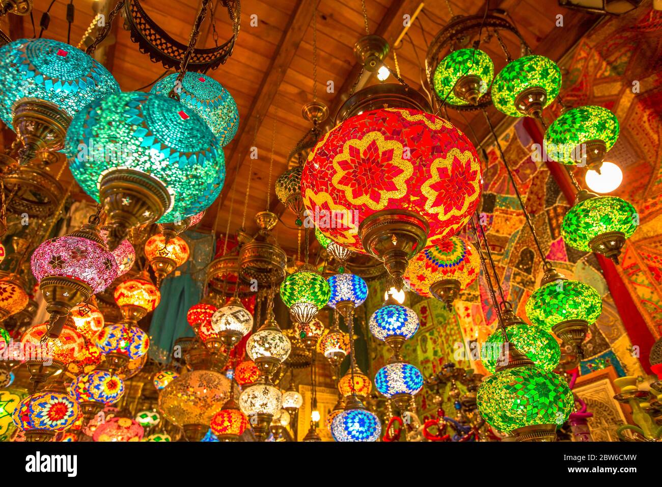 Colorful ceiling chandelier in Arab and Moroccan style. Lanterns lamp hanging down from the ceiling. Stock Photo