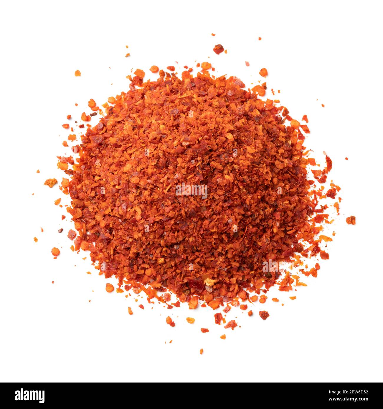 Heap of coarsely ground paprika isolated on white background Stock Photo