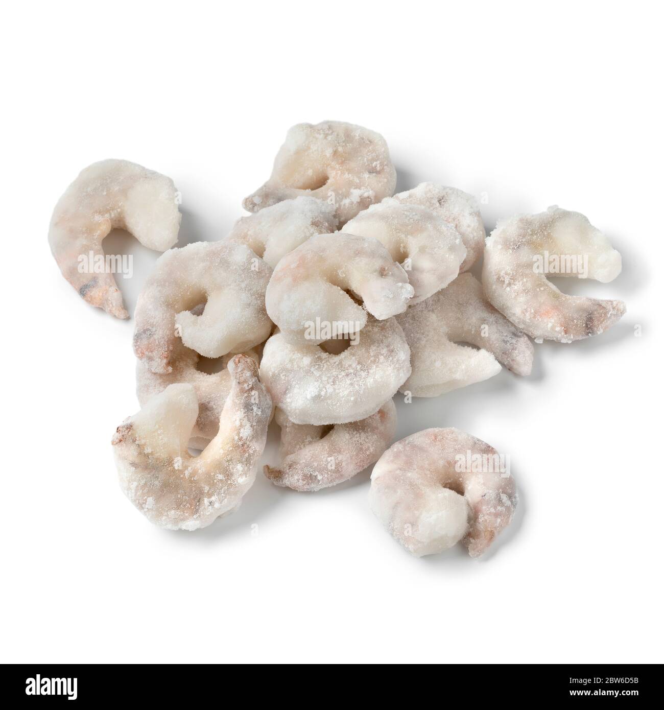 Heap of frozen raw shrimps close up isolated on white background Stock Photo