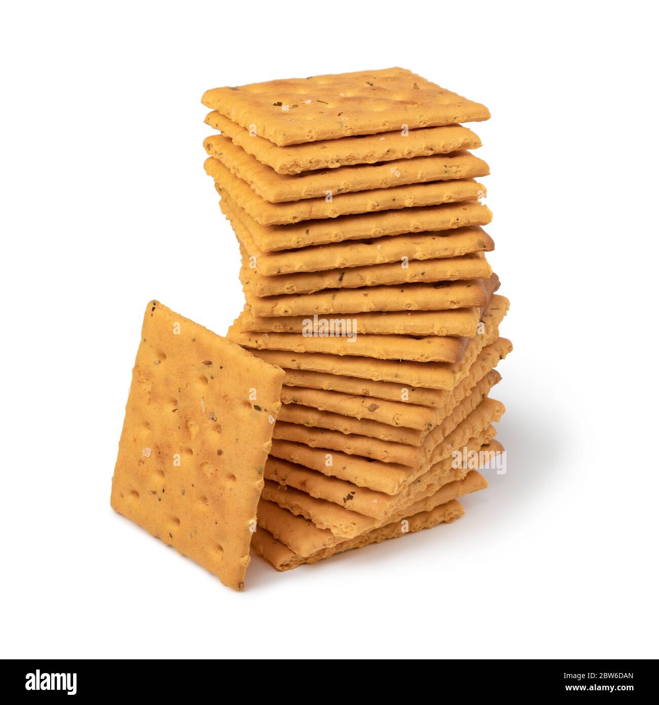 Stack of salted mini crackers with tomato and basil isolated on white background Stock Photo