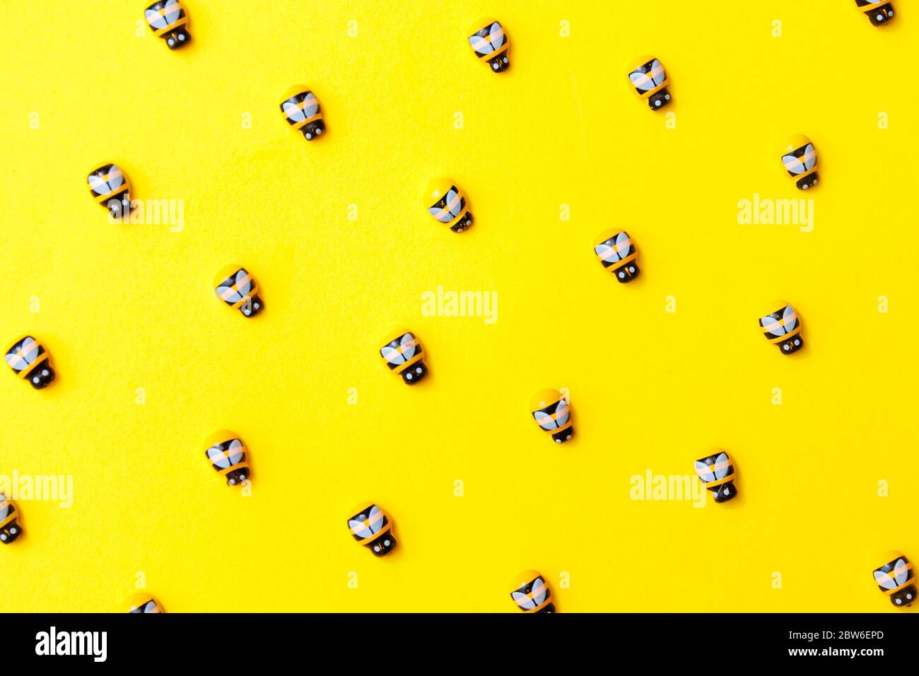 bees on yellow background for wallpaper design. Stock Photo