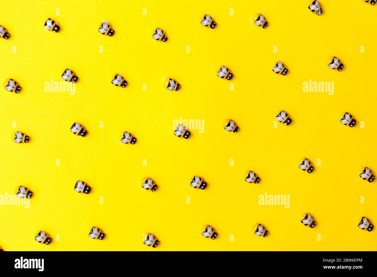 bees on yellow background for wallpaper design. Stock Photo
