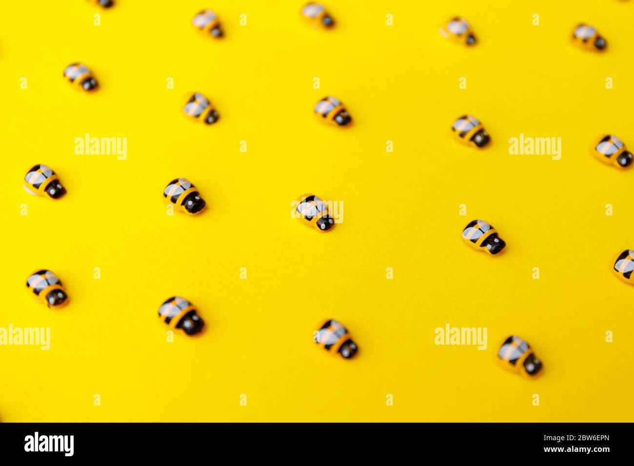 bees on yellow background for wallpaper design. Stock Photo