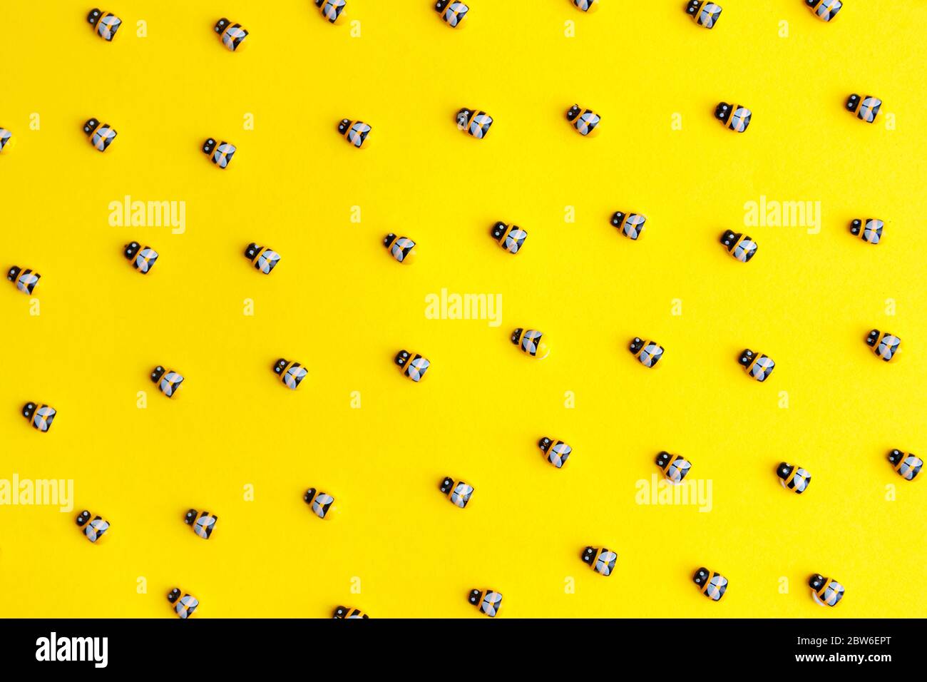 bees on yellow background for wallpaper design. Stock Photo