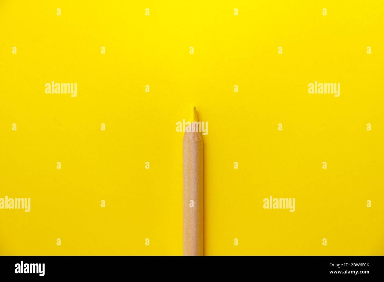 Abstract icon with yellow pencil on yellow background for concept ...